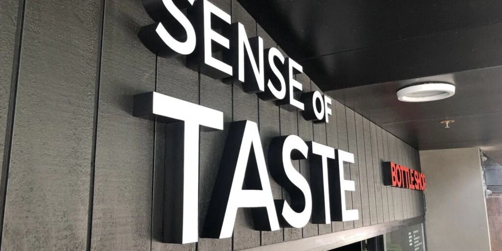 Neon-style illuminated sign for hospitality venue